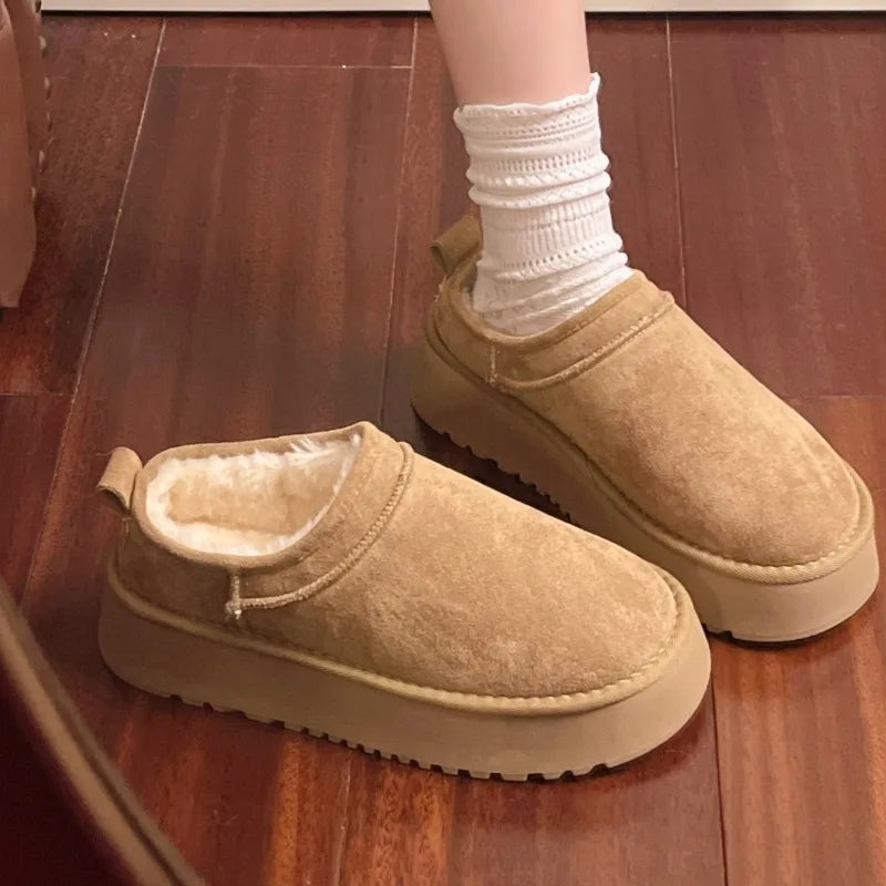 This lady's slippers feature a round-toed one-foot design with a fleece lining for warmth, making them suitable for indoor wear