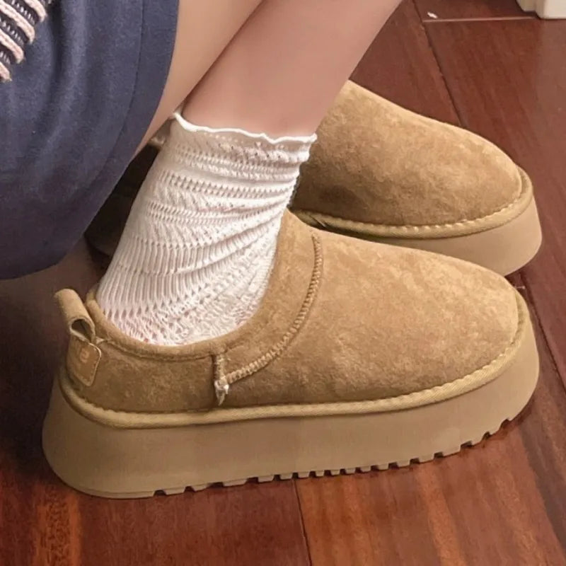 This lady's slippers feature a round-toed one-foot design with a fleece lining for warmth, making them suitable for indoor wear