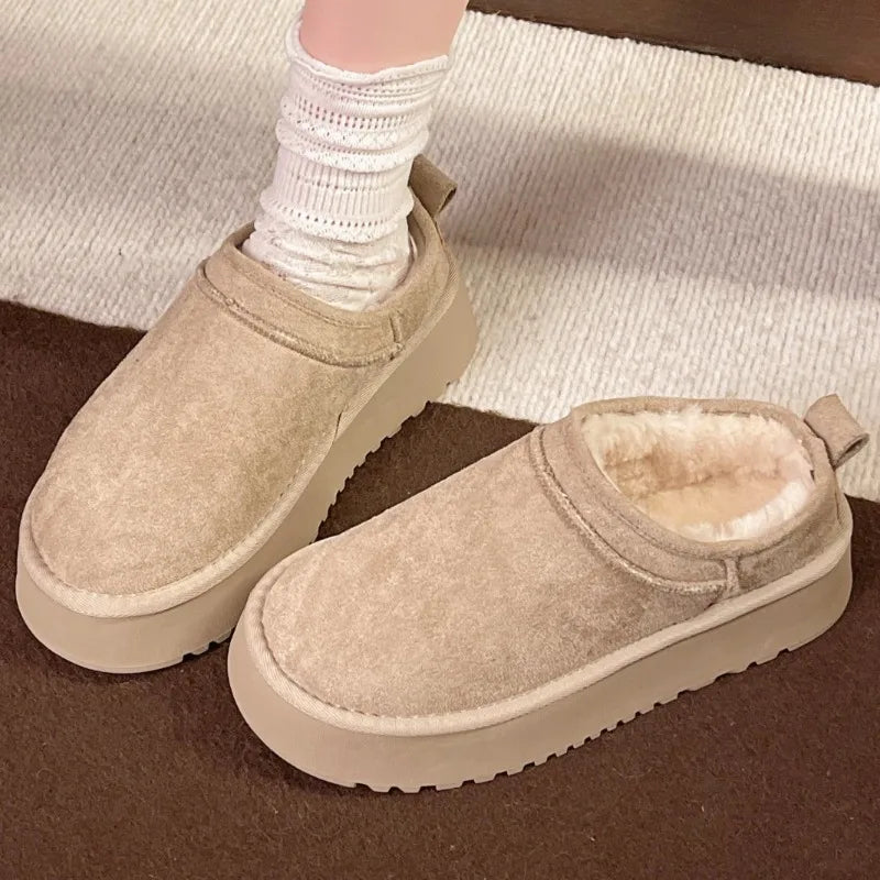 This lady's slippers feature a round-toed one-foot design with a fleece lining for warmth, making them suitable for indoor wear