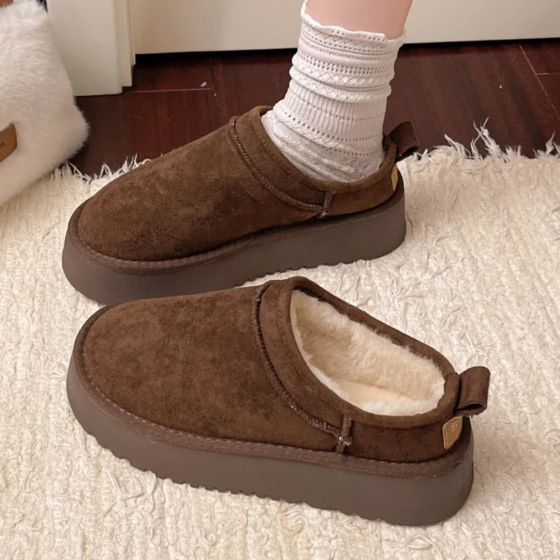 This lady's slippers feature a round-toed one-foot design with a fleece lining for warmth, making them suitable for indoor wear