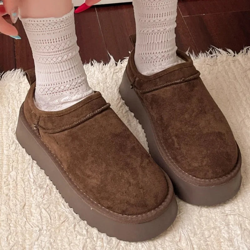 This lady's slippers feature a round-toed one-foot design with a fleece lining for warmth, making them suitable for indoor wear